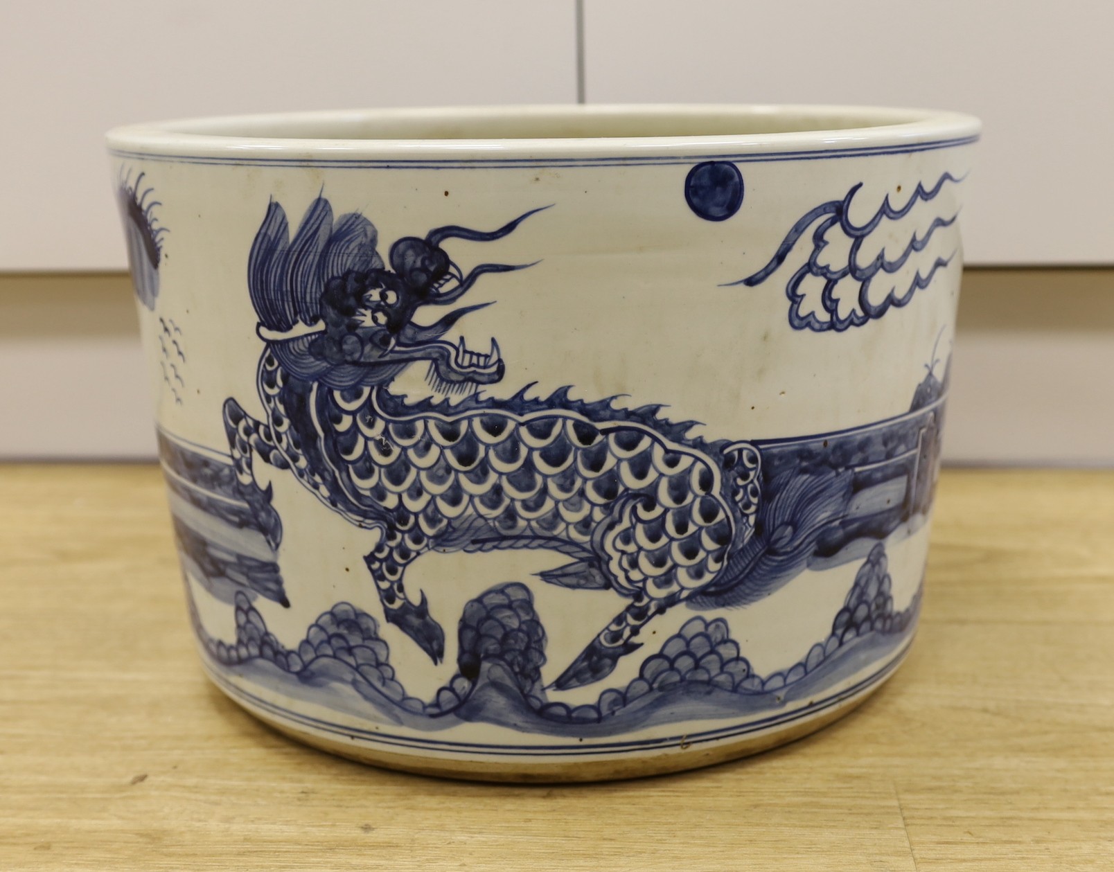 A large Chinese blue and white ‘dragon’ jardiniere, 40cm diameter